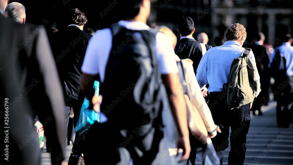 City streets crowded with commuters walking to work