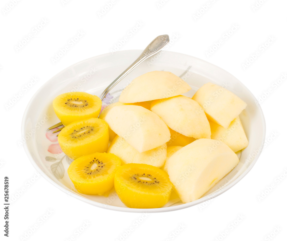 Golden kiwi fruit and sliced apple with fork Golden kiwi fruit and sliced apple with fork
