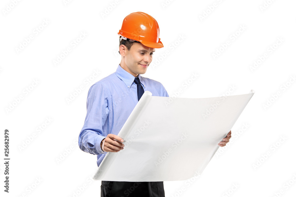 Construction worker looking at blueprints