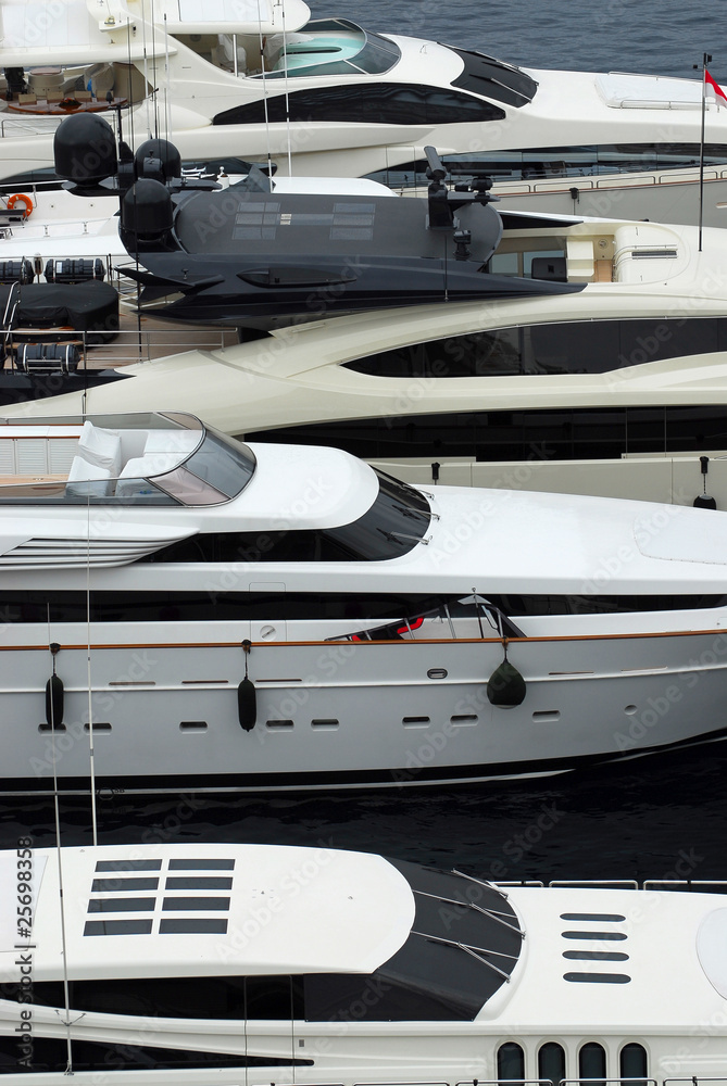 Luxury yachts docked in Monte Carlo Luxury yachts docked in Monte Carlo