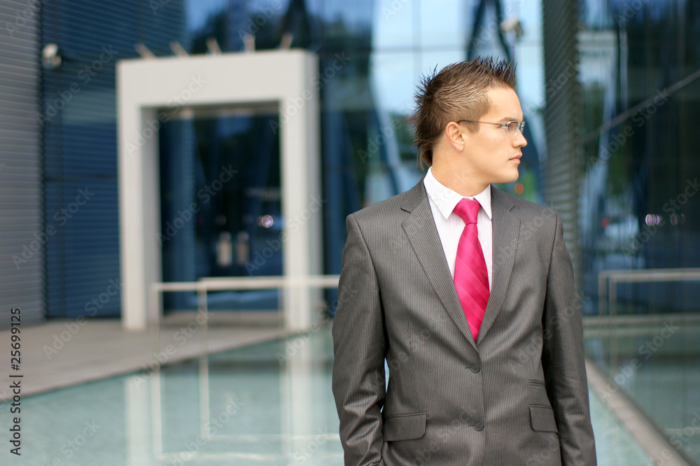 A young business man is looking to the right A young business man is looking to the right