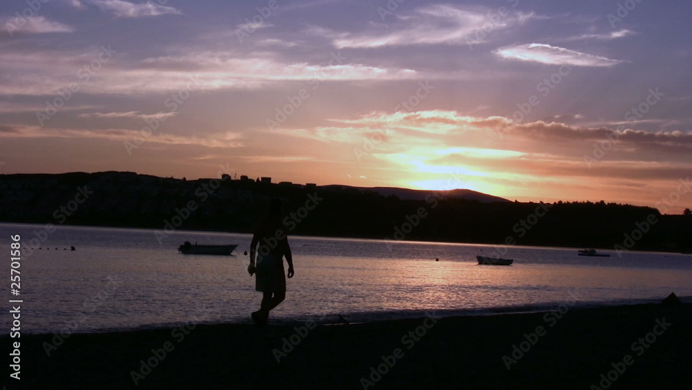 Man walking at the sunset