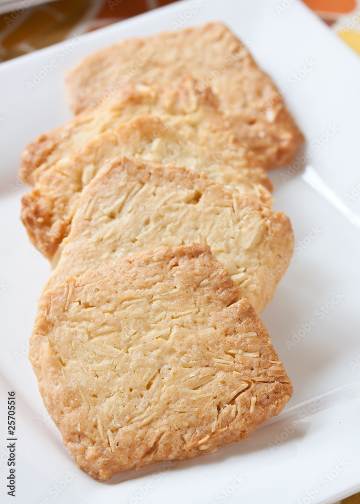 Pastry cakes with sugar on plate. Pastry cakes with sugar on plate.