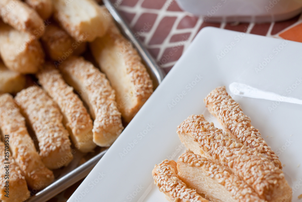 Pastry cakes with sesame on plate. Pastry cakes with sesame on plate.