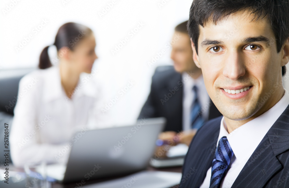 Portrait of successful businessman with colleagues Portrait of successful businessman with colleagues