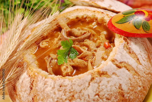 polish tripe soup (flaki) in bread bowl photo