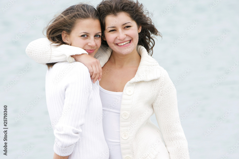 Obraz premium two young happy girls on natural background