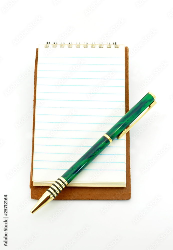 notepad with pen on lower right corner isolated on white notepad with pen on lower right corner isolated on white