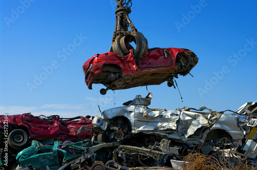 Crane picking up car