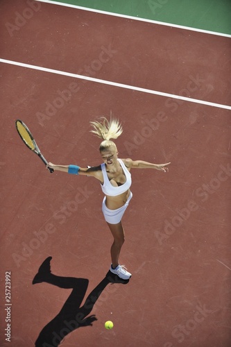 young woman play tennis outdoor © .shock