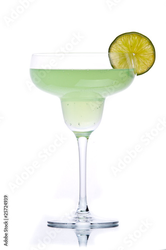Green alcohol cocktail with green lime isolated on white