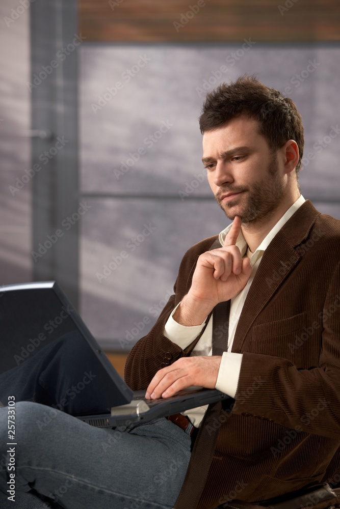 Troubled man with laptop Troubled man with laptop