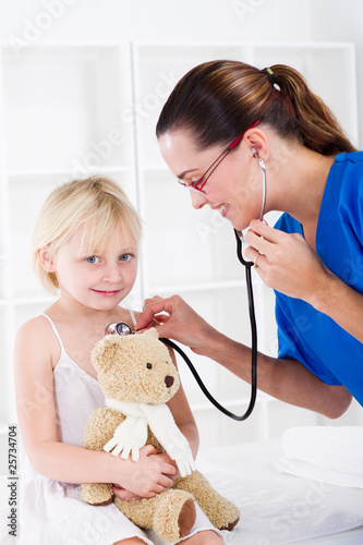 doctor examining little girl