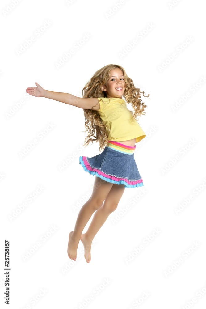 little blond girl jumping in white background