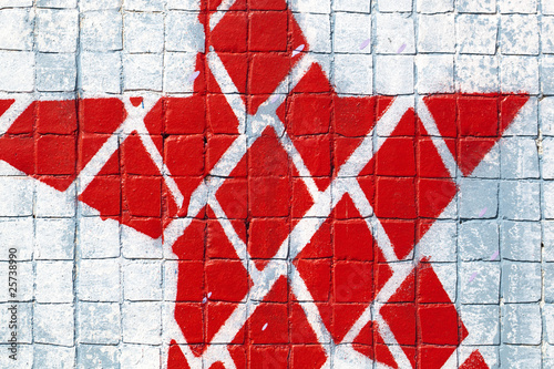 graffiti d'étoile rouge sur mosaique murale
