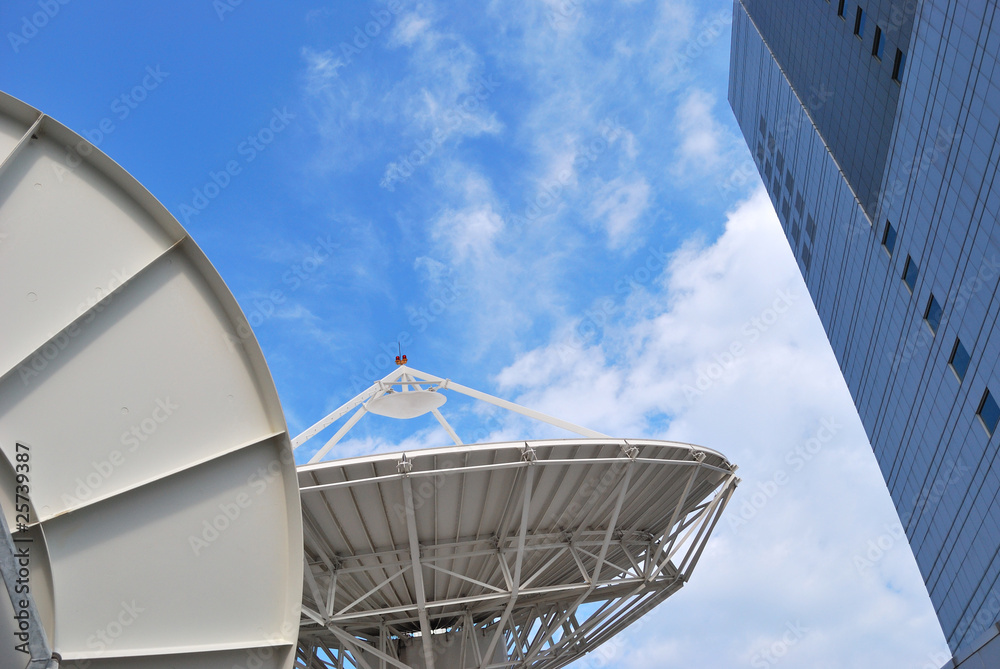 Satellite dishes on buildings.