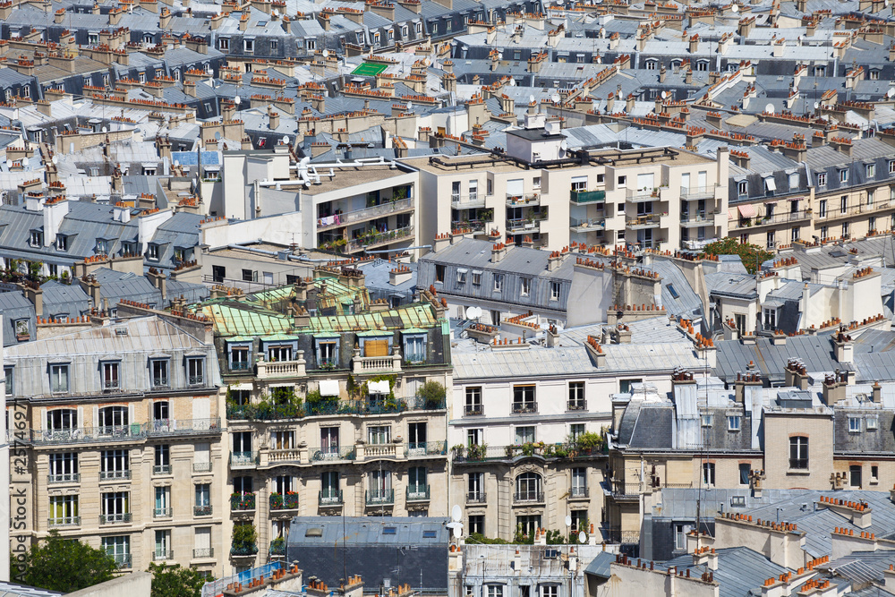 Hundreds of chimneys on the roofs of Paris downtown
