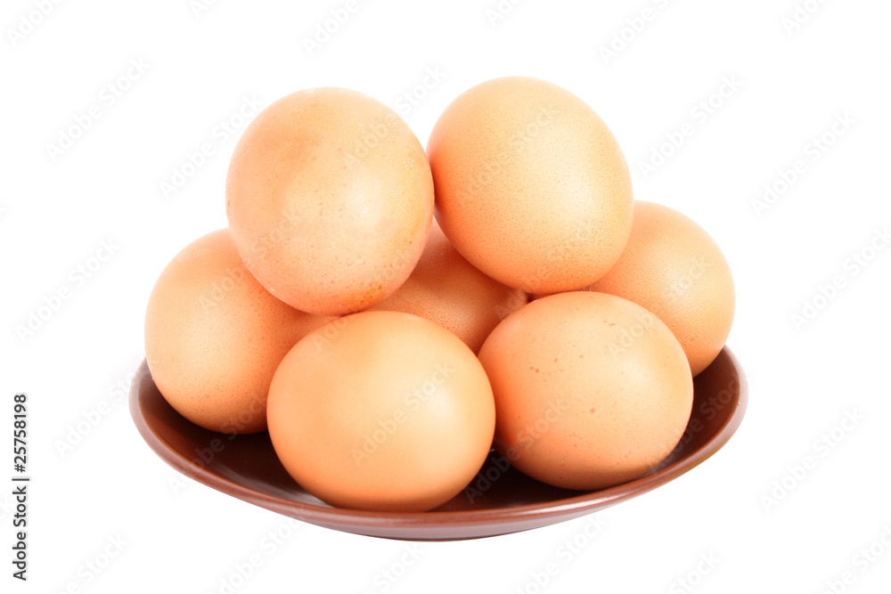 Group of brown hen's eggs in the plate isolated on white Group of brown hen's eggs in the plate isolated on white