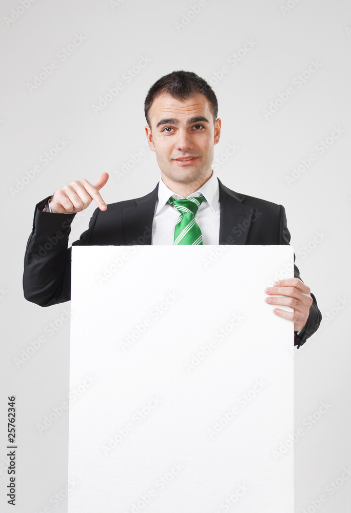 businessman pointing to white blank card businessman pointing to white blank card
