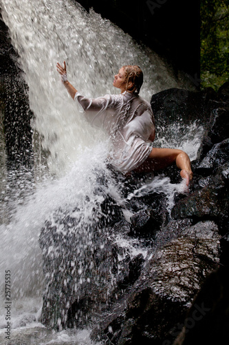 Young Woman Near The Waterfall