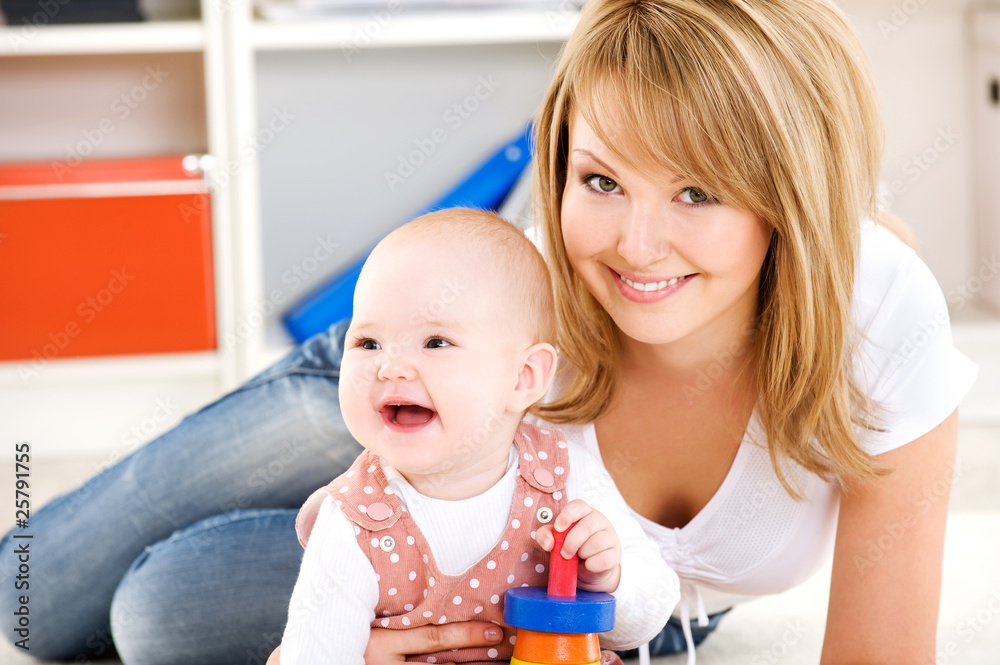 Baby playing with toys with happy mother Baby playing with toys with happy mother