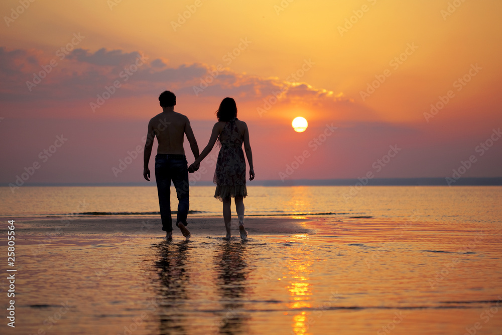 Two people in love at sunset