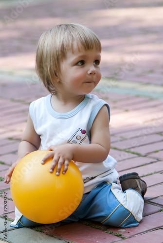 The little boy with a ball in hands