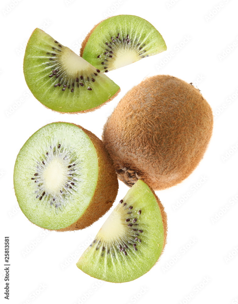 Fototapeta premium Falling kiwi fruit and kiwi slices.