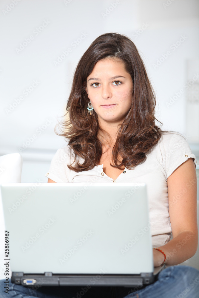 Closeup of teenager girl with laptop computer Closeup of teenager girl with laptop computer