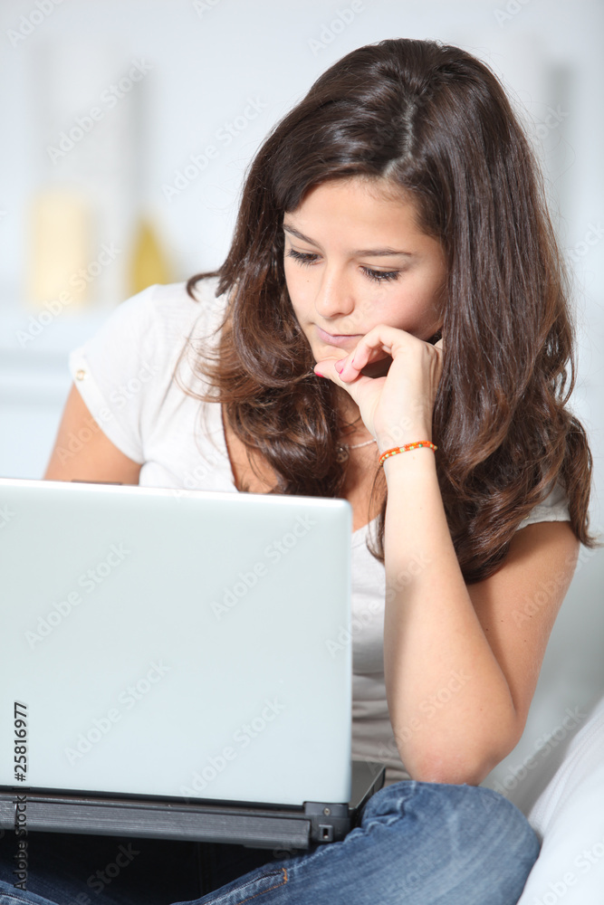 Closeup of teenager girl with laptop computer Closeup of teenager girl with laptop computer