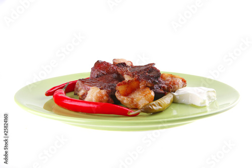 roast meat chunks on green plate