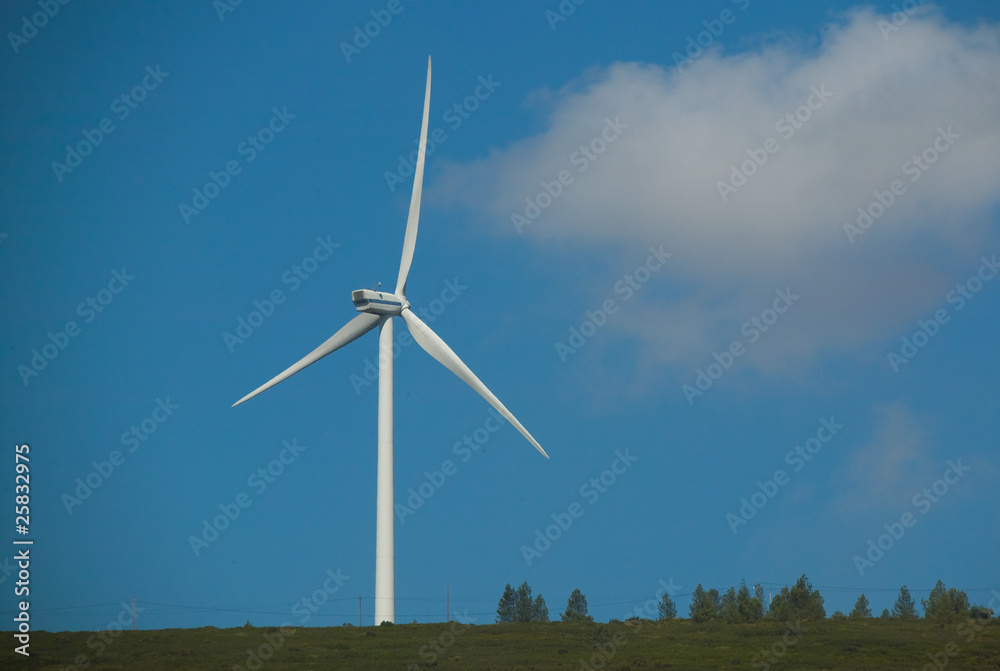 Modern white wind turbine or wind mill producing clean energy Modern white wind turbine or wind mill producing clean energy