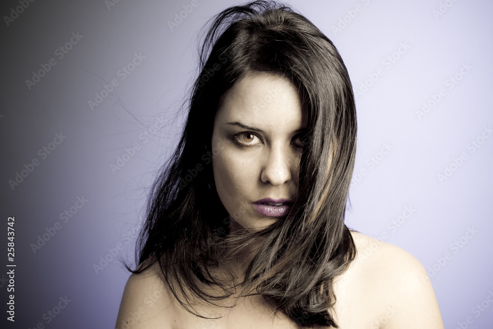 Fototapeta premium Voluptuous look of brunette young woman. intense expression. inn