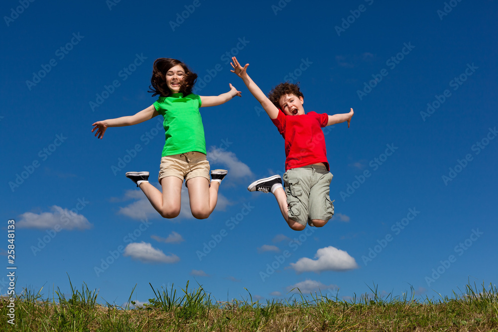 Girl and boy jumping, running outdoor Girl and boy jumping, running outdoor