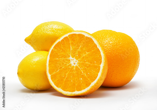 Fresh oranges and lemons isolated on white