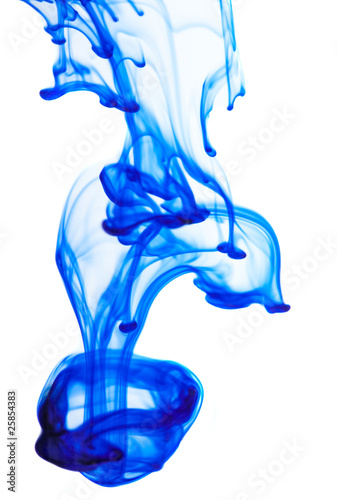 Blue ink in the water on a white background