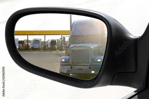 rearview car driving mirror overtaking big truck © lunamarina
