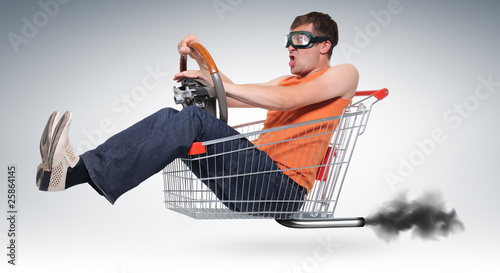 Unreal crazy driver in a shopping-cart with wheel photo