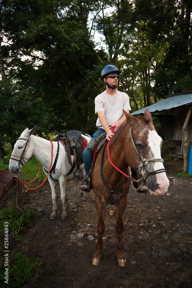 European or American man on horseback in Costa Rica European or American man on horseback in Costa Rica