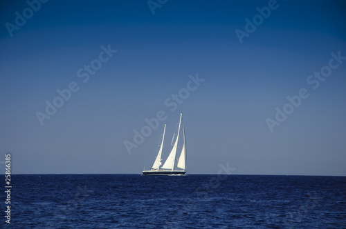 Yacht sailing in the blue ocean