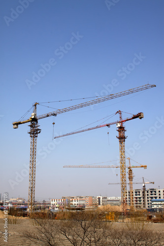 high-rise building and crane