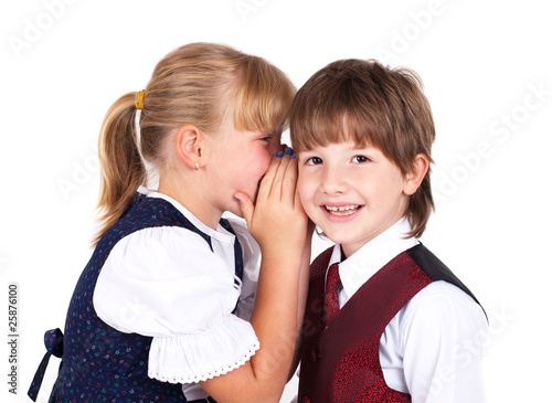 Two little kids telling secrets photo