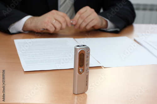 Businessman interviewing with a dictaphone photo
