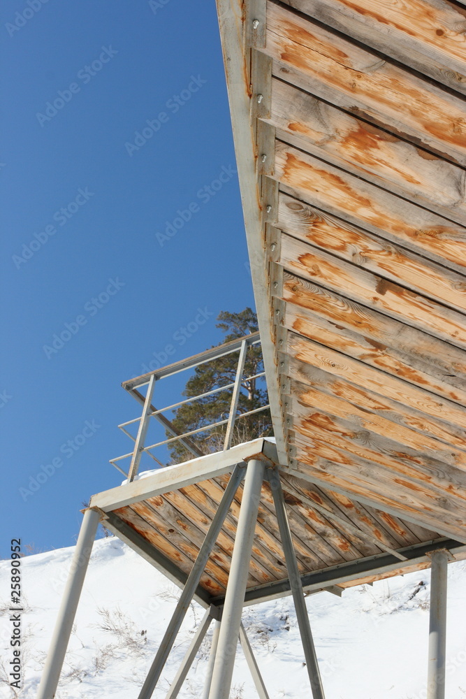 Obraz premium Wooden steps of the stairs against a blue sky