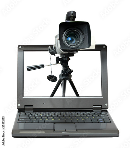 laptop with video camera on tripod