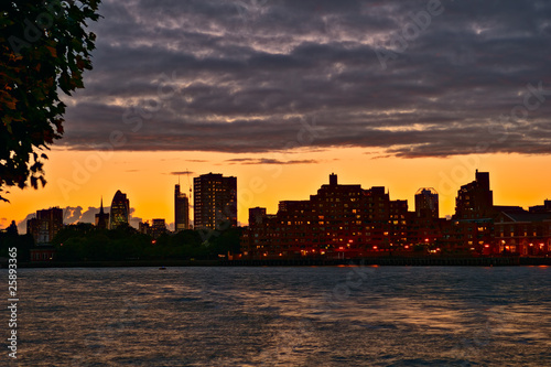 View over River Thames to Wapping and the City at sunset  London