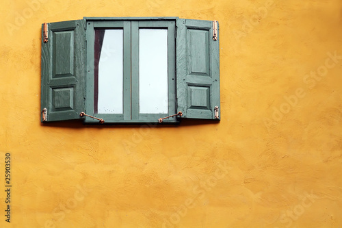 green windows on orange wall