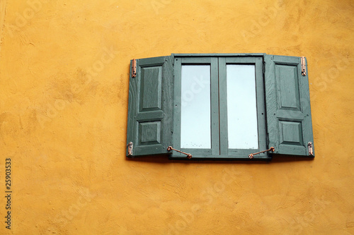 green windows on orange wall