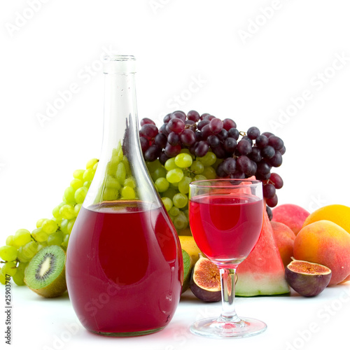 Bottle of wine, glass and fruits