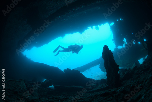 A female scuba diver exploring the  SS Dunraven shipwreck. photo